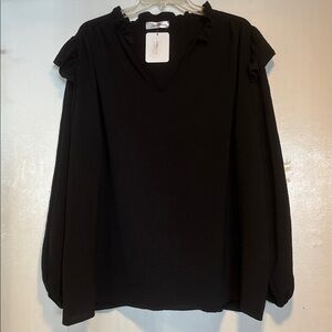 Perfectly Priscilla, NWT, jet black blouse. Unique design. Comfy and versatile.